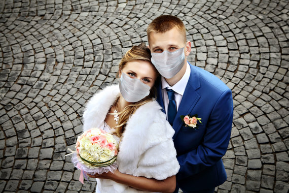 Photo from 123RF.com / Newlyweds wear protective masks