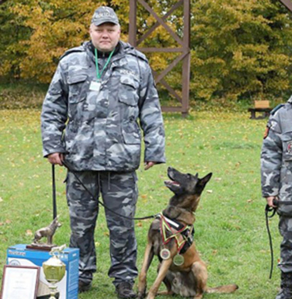 Police File Photo / Saulius Žymantas with four attendees at the Grant Cynologist Competition in 2017 had won second place