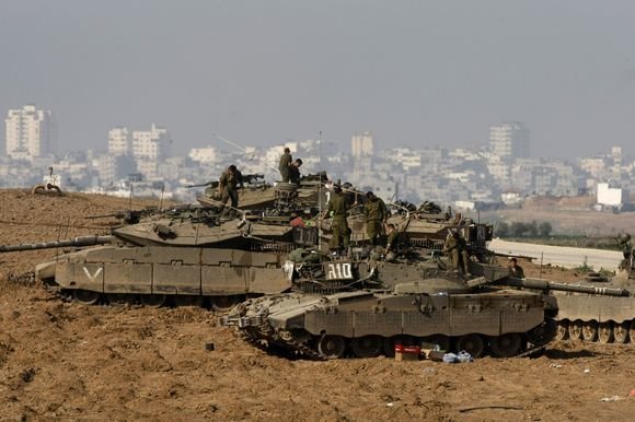 AFP/„Scanpix“ nuotr./Izraelio pajėgos prie Gazos ruožo
