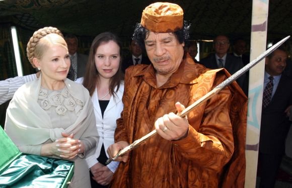 AFP/„Scanpix“ nuotr./Ukrainos premjerė Julija Tymošenko ir Muamaras Kadhafi (Tripolis, 2009 m.)