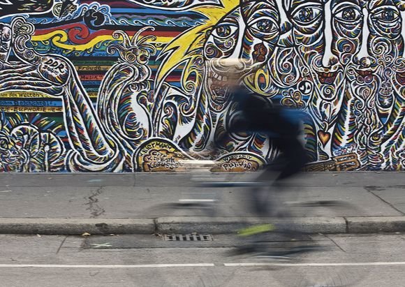 AFP/„Scanpix“ nuotr./Berlyne iškilmingai atidengtas restauruotas Berlyno sienos fragmentas