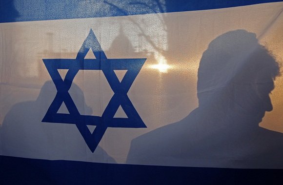 „Reuters“/„Scanpix“ nuotr./Izraelio vėliava