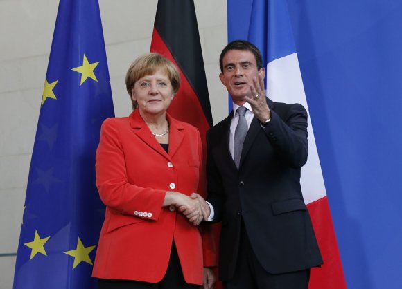 „Reuters“/„Scanpix“ nuotr./Angela Merkel ir Manuelis Vallsas Berlyne