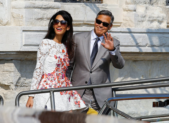 „Reuters“/„Scanpix“ nuotr./George'as Clooney su žmona  Amal Alamuddin