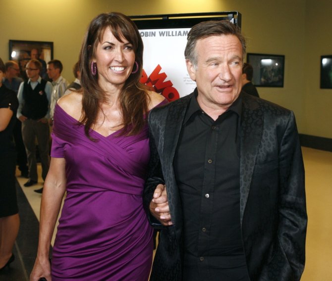 „Reuters“/„Scanpix“ nuotr./Robinas Williamsas su trečiąja žmona Susan Schneider (2009 m.)
