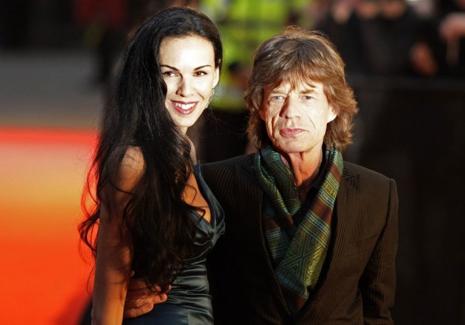 AFP/„Scanpix“ nuotr./Mickas Jaggeris ir L'Wren Scott (2008 m. balandžio 2 d.)