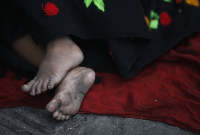 „Reuters“/„Scanpix“ nuotr./Benamis vaikas Bangladeše