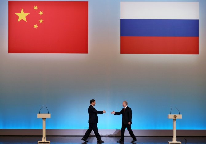 AFP/„Scanpix“ nuotr./Kinijos prezidentas Xi Jinpingas ir Rusijos prezidentas Vladimiras Putinas