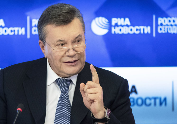 „Scanpix“/AP nuotr./Viktoras Janukovyčius spaudos konferencijoje Maskvoje