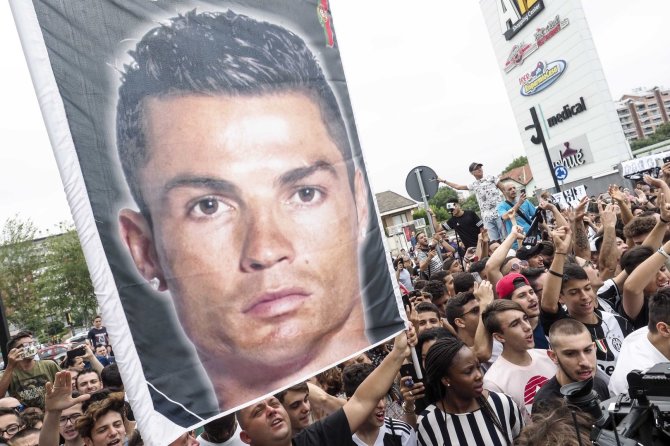 „Scanpix“ nuotr./Cristiano Ronaldo sutiktas Turine