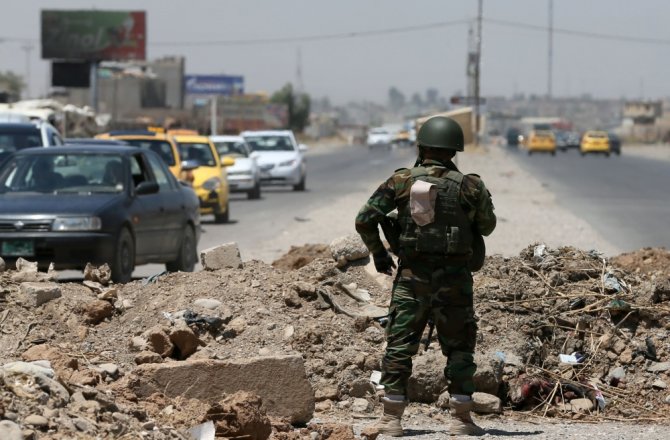 AFP/„Scanpix“ nuotr./Džihadistų kovotojas Irake