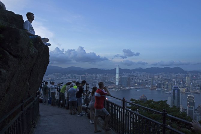 „Scanpix“/AP nuotr./Pakeliui į Viktorijos viršūnę Honkonge