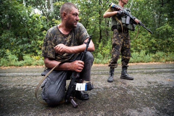 AFP/„Scanpix“ nuotr./Ukrainos kariai Donecko regione