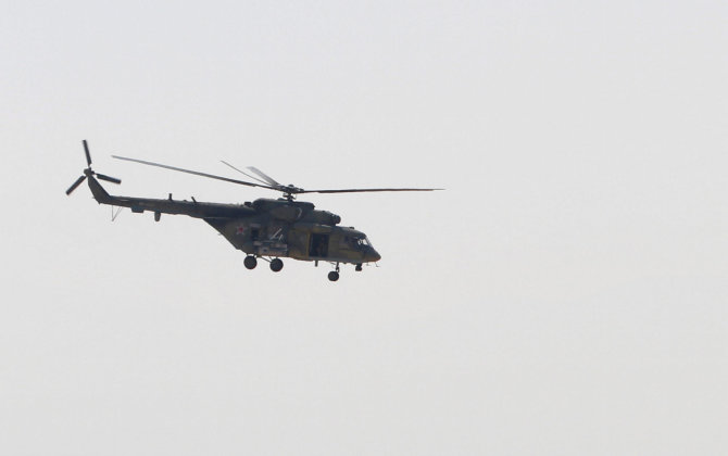 „Reuters“/„Scanpix“ nuotr./Rusijos sraigtasparnis