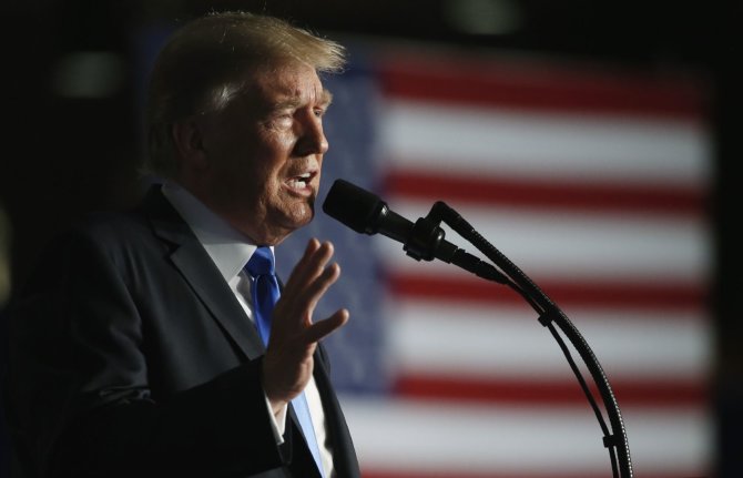„Reuters“/„Scanpix“ nuotr./JAV prezidento Donaldo Trumpo kalba