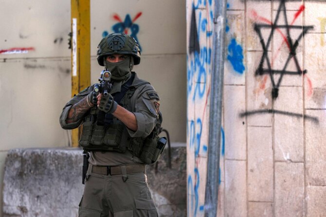 Izraelio karys/ HAZEM BADER / AFP