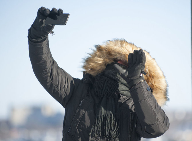 AFP/„Scanpix“ nuotr./Kanadą ir JAV šiaurinius regionus sukaustė arktinis šaltis