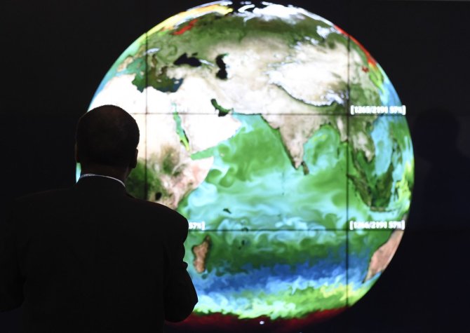 AFP/„Scanpix“ nuotr./Klimato kaitos konferencijos dalyvis