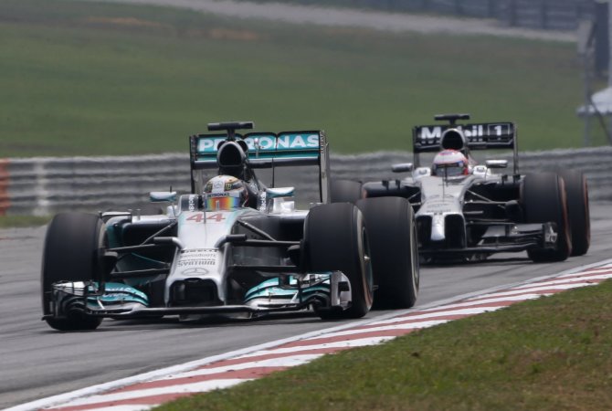 „Reuters“/„Scanpix“ nuotr./Lewisas Hamiltonas ir Jensonas Buttonas