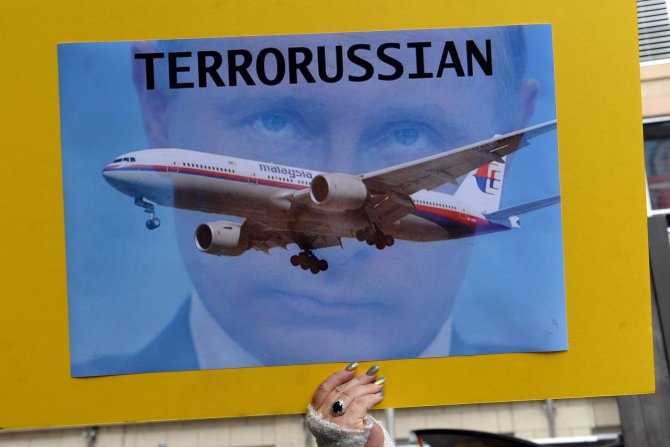 AFP/„Scanpix“ nuotr./V.Putinas atvirai kaltinamas dėl Malaizijos lėktuvo katastrofos
