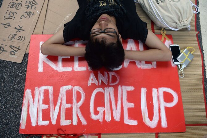 AFP/„Scanpix“ nuotr./Protestuotojas Honkonge