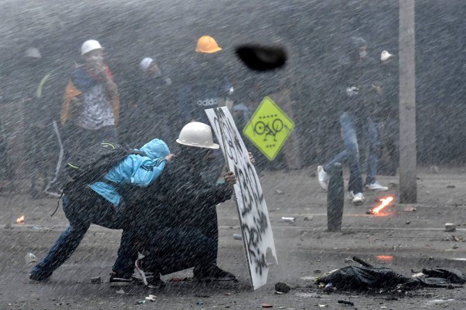 AFP/„Scanpix“ nuotr./Protestai Kolumbijoje