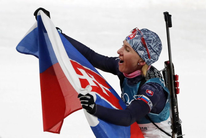 „Reuters“/„Scanpix“ nuotr./Anastasija Kuzmina laimėjo olimpinį aukso medalį biatlono bendro starto rungtyje.