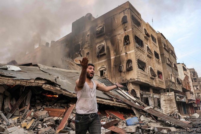 „AFP“/„Scanpix“/Gazos Ruožo gyventojas po apšaudymo