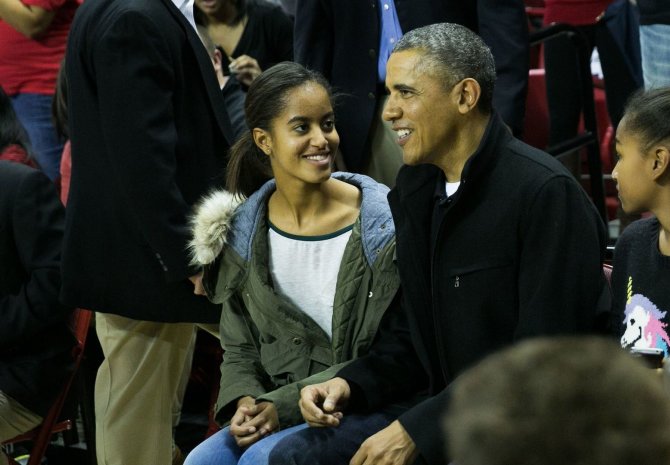„Scanpix“/„Sipa Press“ nuotr./Barackas Obama su dukra Malia