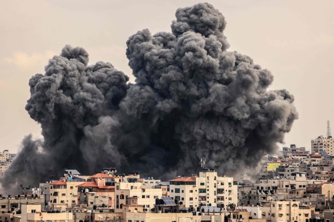 AFP/„Scanpix“ nuotr./Izraelio smūgis Gazos Ruože