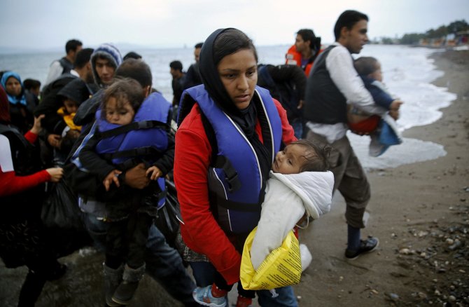 „Reuters“/„Scanpix“ nuotr./Graikijos Koso saloje išsilaipinę pabėgeliai iš Afganistano ir Sirijos