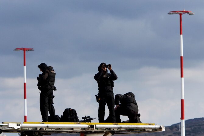 AFP/„Scanpix“ nuotr./Pareigūnai