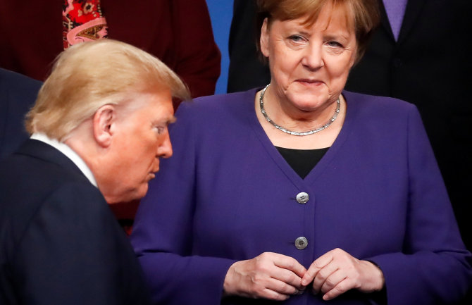 AFP/„Scanpix“ nuotr./Donaldas Trumpas ir Angela Merkel