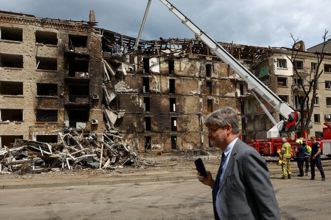 „Reuters“/„Scanpix“/Rusijos atakos prieš Kyjivą padariniai