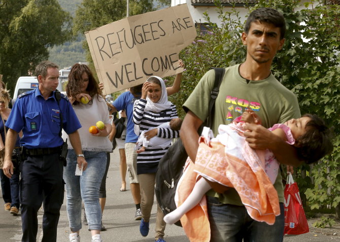 „Reuters“/„Scanpix“ nuotr./Migrantai Šveicarijoje