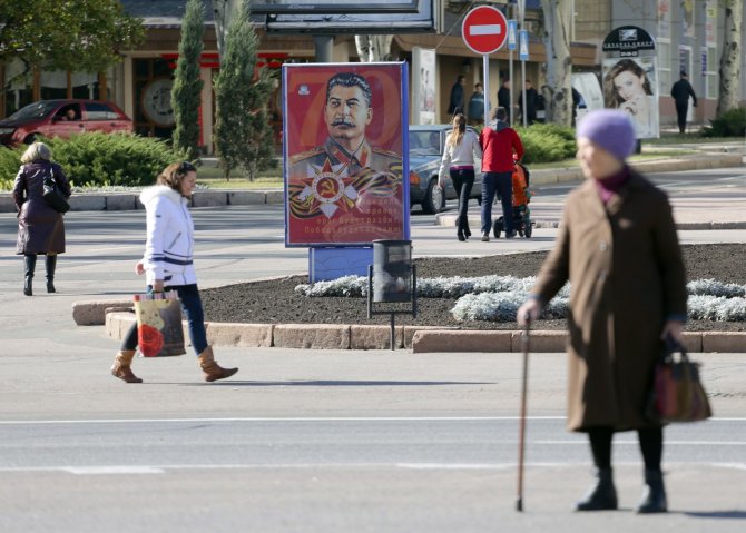 AFP/„Scanpix“ nuotr./Stalino portretas Donecko miesto gatvėje
