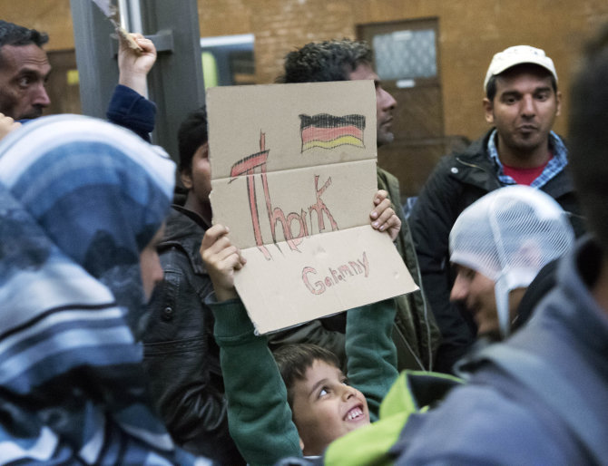 „Scanpix“/AP nuotr./Į Vokietiją atvykę pabėgėliai 