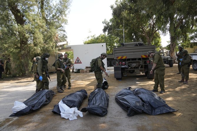 „Scanpix“/AP nuotr./„Hamas“ žudynių vaizdai Kfar Azza kibuce Izraelyje