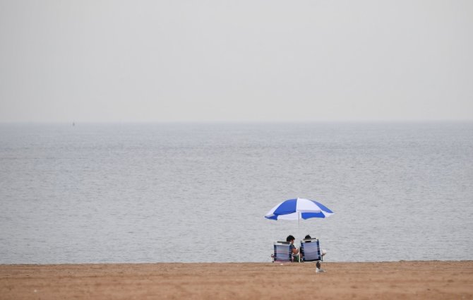 AFP/„Scanpix“ nuotr./Tuščias paplūdimys