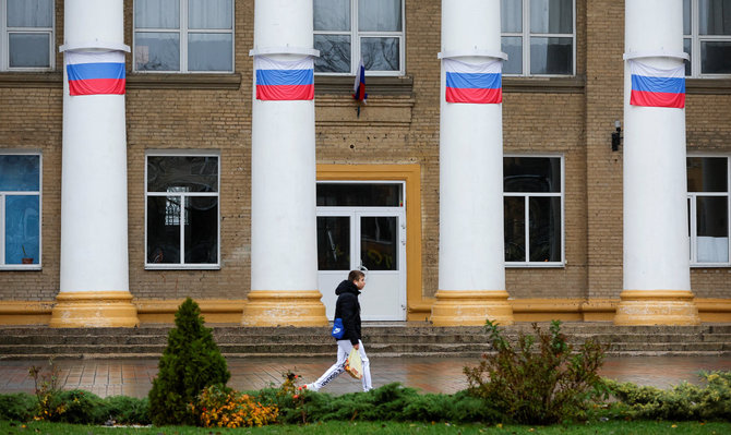 „Reuters“/„Scanpix“/Rusijos Federacijos vėliavos Melitopolyje