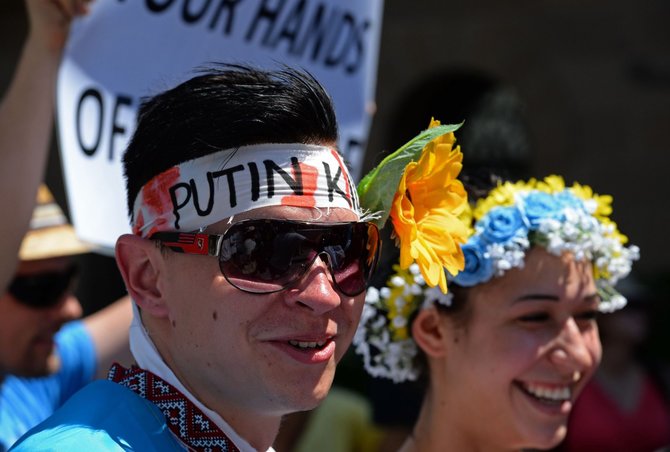 AFP/„Scanpix“ nuotr./Protestas Australijoje prieš V.Putiną