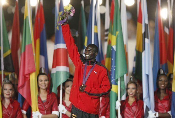 „Scanpix“ nuotr./Stephenas Kiprotichas iš Ugandos laimėjo aukso medalį maratono bėgime