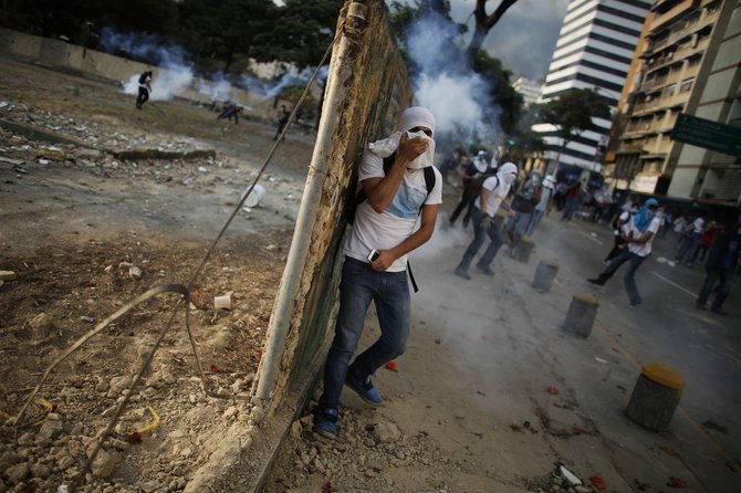 „Reuters“/„Scanpix“ nuotr./Protestuotojai Venesueloje