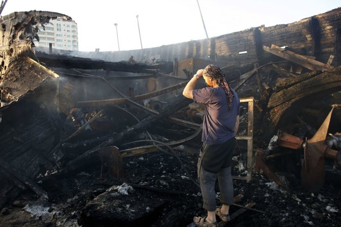 AFP/„Scanpix“ nuotr./Izraelio oro atakų padariniai Gazos Ruože
