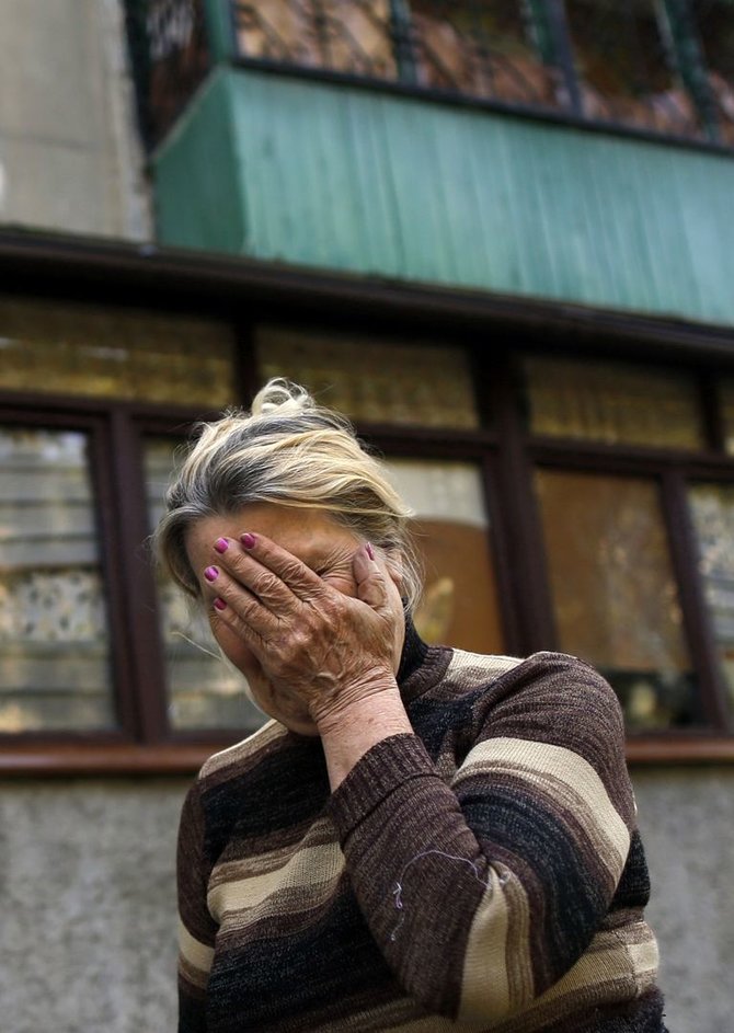 AFP/„Scanpix“ nuotr./Moteris Ukrainoje