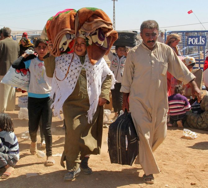 „Scanpix“/„Anadolu Ajansi“ nuotr./Sirijos kurdų pabėgėliai plūsta į Turkiją.