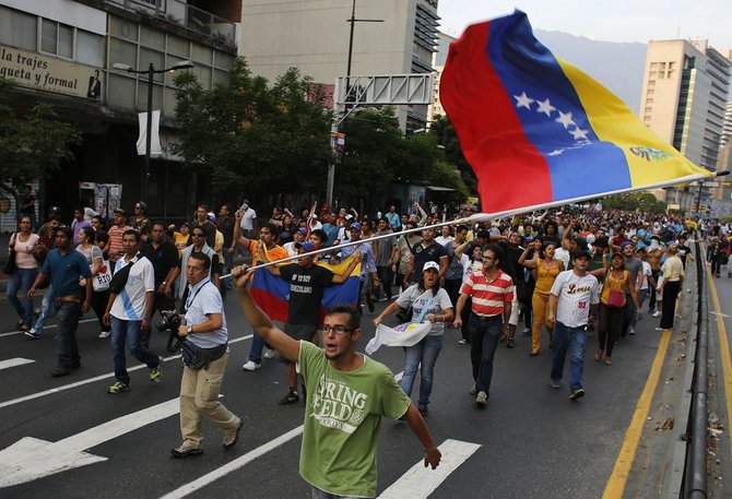 „Reuters“/„Scanpix“ nuotr./Protestuotojai Venesueloje