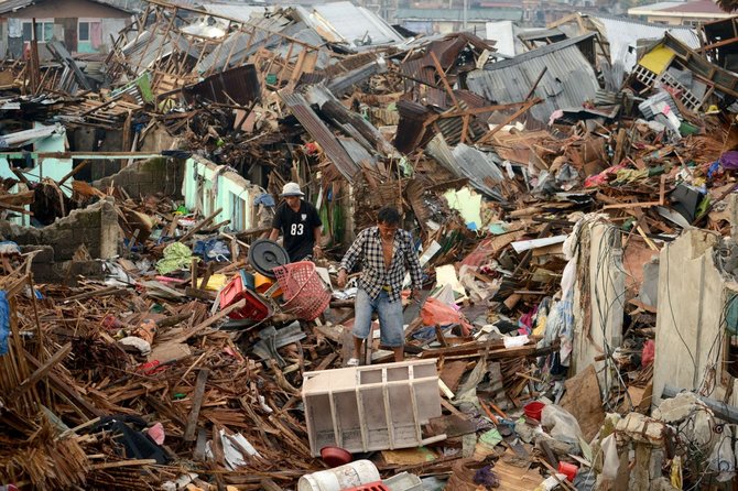 AFP/„Scanpix“ nuotr./Taip atrodo taifūno nusiaubti Filipinai