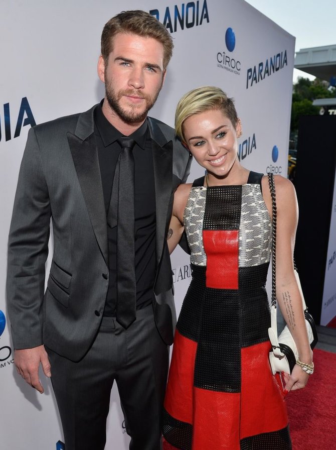 AFP/„Scanpix“ nuotr./Liamas Hemsworthas ir Miley Cyrus (2013 m.)