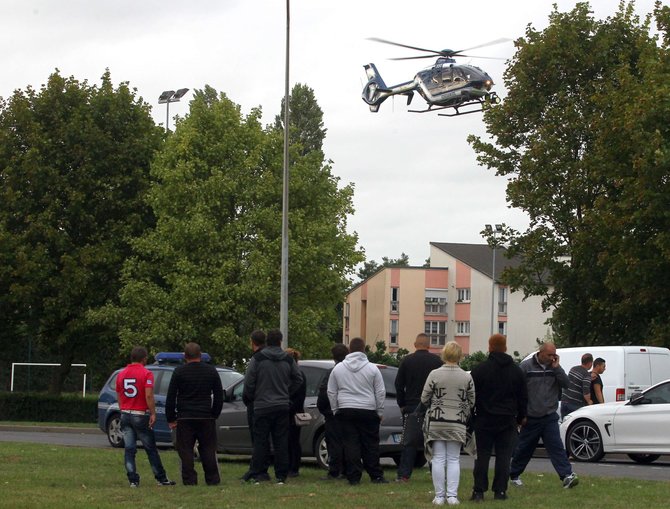 AFP/„Scanpix“ nuotr./Pareigūnai Rua mieste